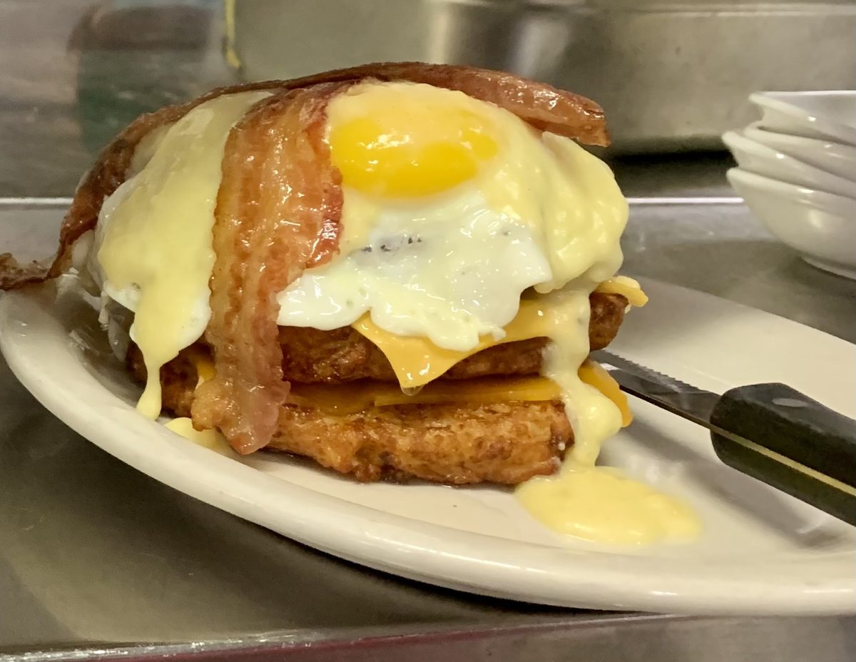Egg-A-Bagel Pile Up: potato pancakes with eggs, bacon and hollandaise