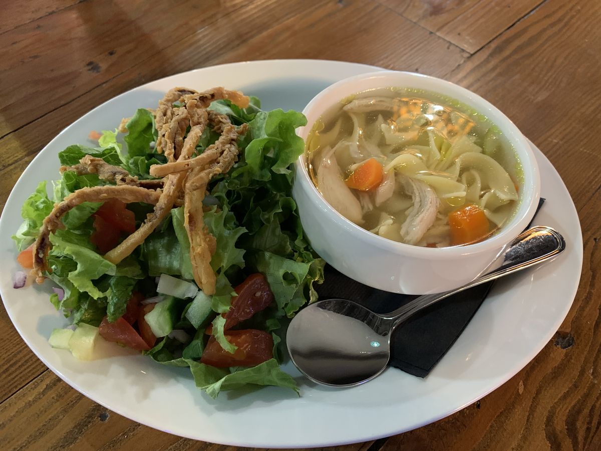 Chicken noodle soup with a side salad