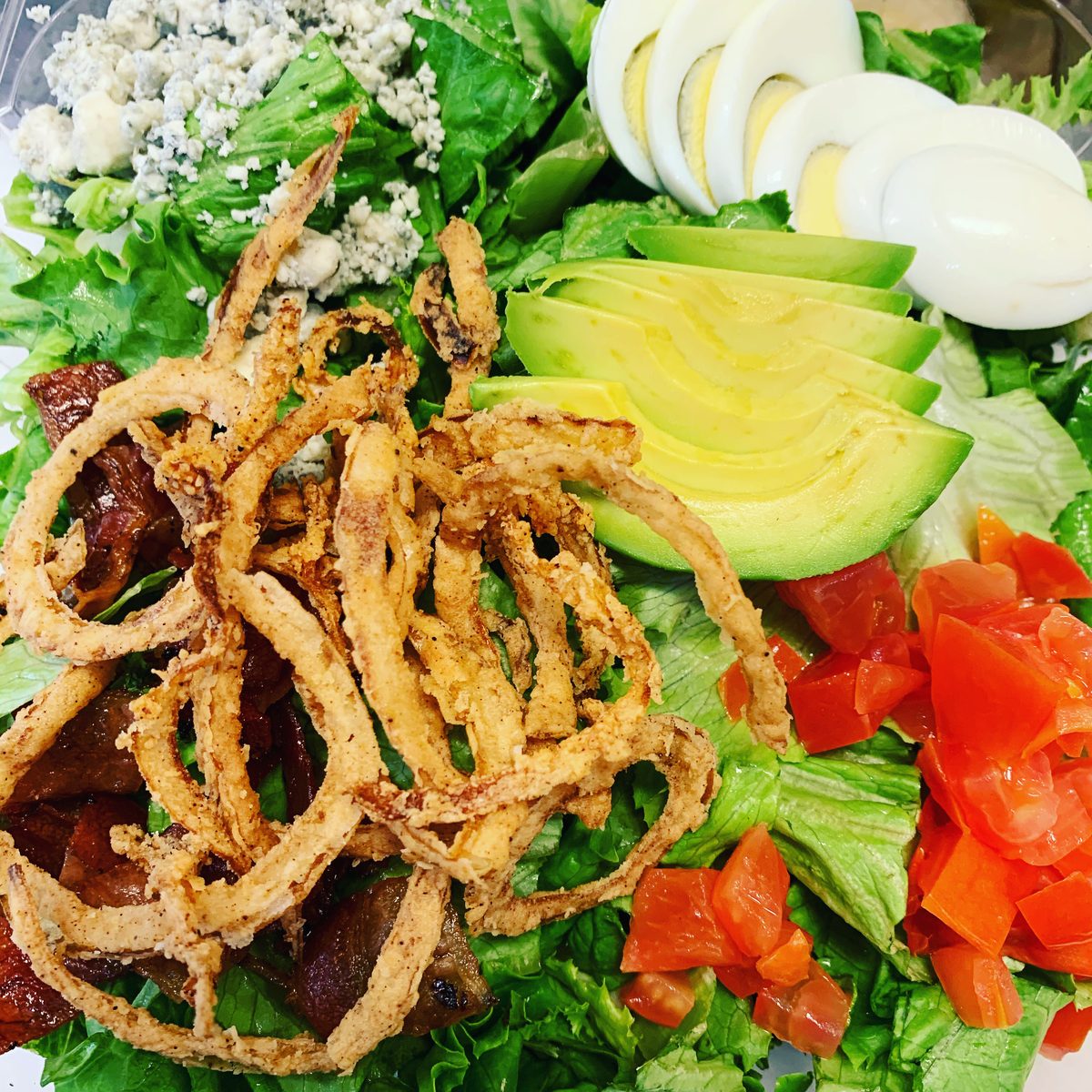 Bacon Cobb salad with bleu cheese, egg and avocado