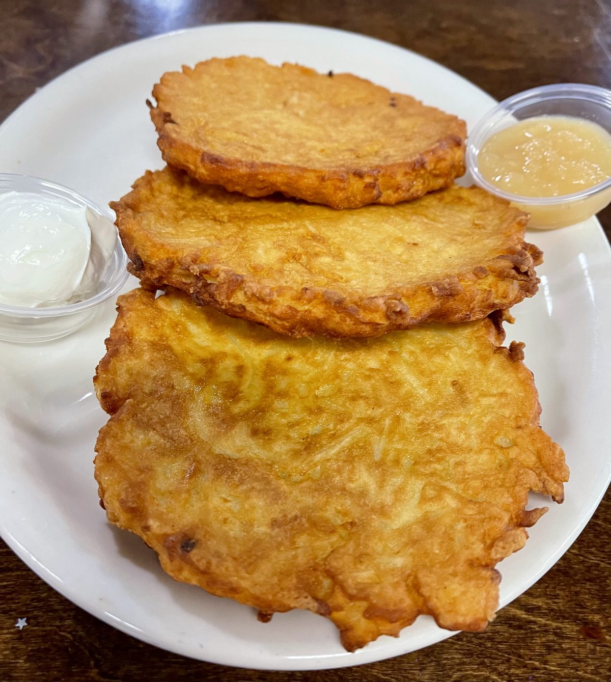 Potato latkes with sour cream and applesauce